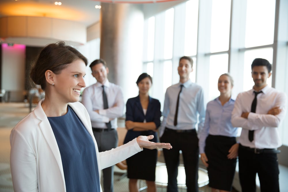 happy-female-executive-manager-with-team
